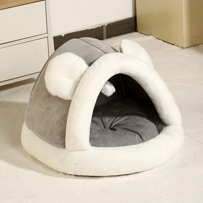 Self-warming cat cave bed designed for small pets with a cozy tent structure and plush material.
