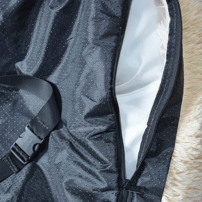 Close-up of the interior of a washable dog car seat bed, featuring a durable black material and zipper detail.