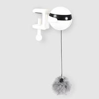 Interactive electronic cat toy in use, providing engagement and playtime for a curious cat.