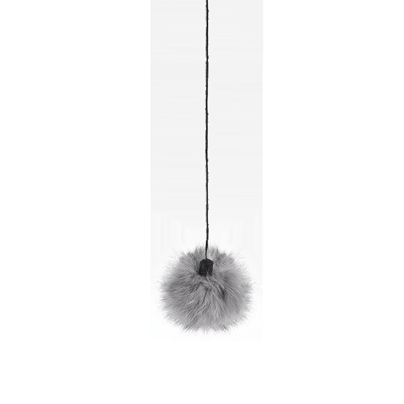 Interactive electronic cat toy in use, providing engagement and playtime for a curious cat.