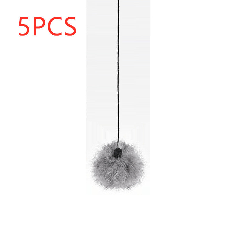 Interactive electronic cat toy in use, providing engagement and playtime for a curious cat.
