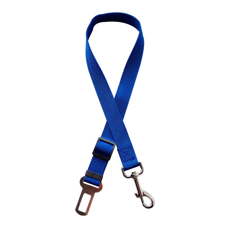 Golden retriever in adjustable pet safety seat belt attached to car seat for secure travel.