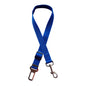 Golden retriever in adjustable pet safety seat belt attached to car seat for secure travel.