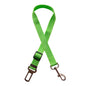 Golden retriever in adjustable pet safety seat belt attached to car seat for secure travel.
