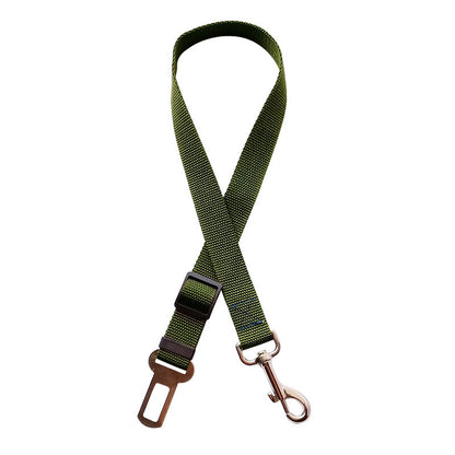 Golden retriever in adjustable pet safety seat belt attached to car seat for secure travel.