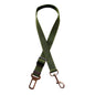 Golden retriever in adjustable pet safety seat belt attached to car seat for secure travel.