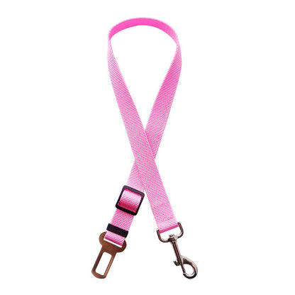 Golden retriever in adjustable pet safety seat belt attached to car seat for secure travel.