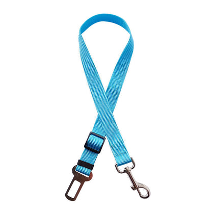 Golden retriever in adjustable pet safety seat belt attached to car seat for secure travel.