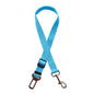 Golden retriever in adjustable pet safety seat belt attached to car seat for secure travel.