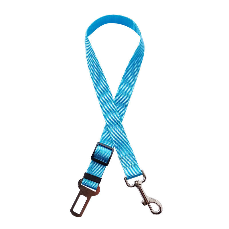 Golden retriever in adjustable pet safety seat belt attached to car seat for secure travel.
