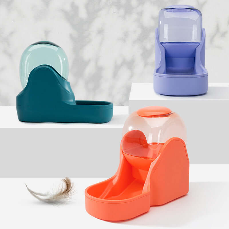 Automatic pet water fountain in three colors: teal, purple, and orange, designed for pet hydration and feeding.