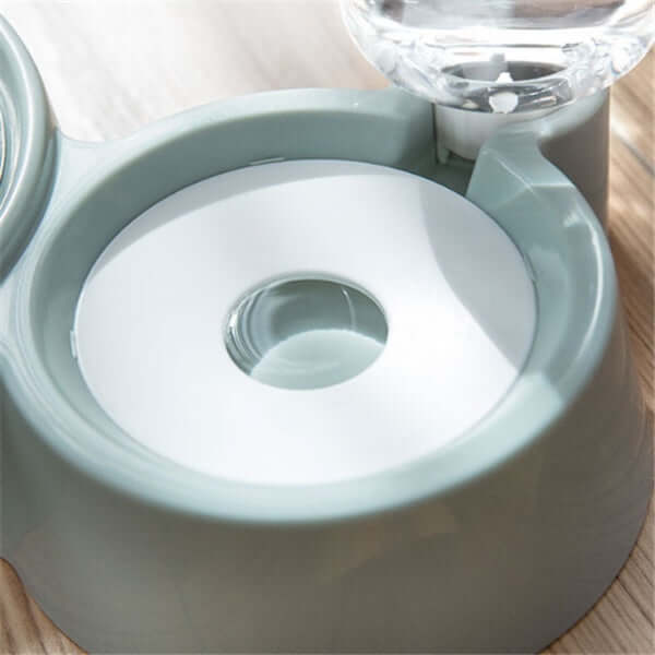 Close-up of the inside of an automatic dog water bowl showcasing the water refill mechanism.