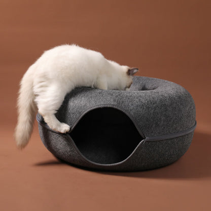 Cat exploring the 2-in-1 felt cat tunnel bed, a grey woolen felt interactive training toy.