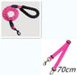 65553d0e476faf20ef477285f49ee2e4Person walking a dog on a reflective nylon dog leash in a forested area.