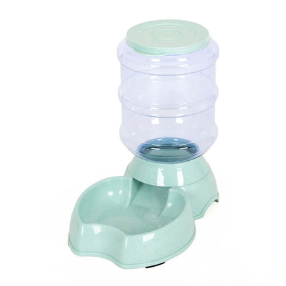 Automatic dog water bowl with transparent water container and mint green base.