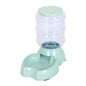 Automatic dog water bowl with transparent water container and mint green base.