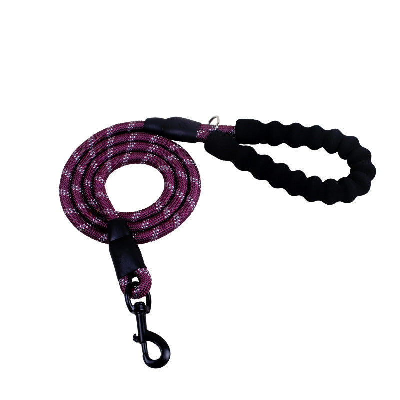 fc70f963c9e427f41bba69125c744e6fPerson walking a dog on a reflective nylon dog leash in a forested area.