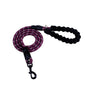 fc70f963c9e427f41bba69125c744e6fPerson walking a dog on a reflective nylon dog leash in a forested area.