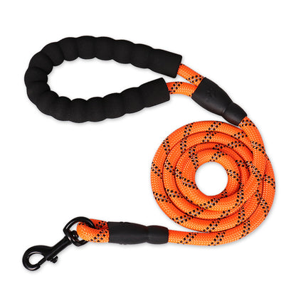 16460166d618d77036554f1b171681d4Person walking a dog on a reflective nylon dog leash in a forested area.