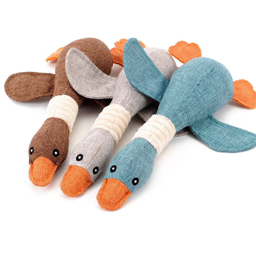 Interactive plush squeaky dog toy featuring a variety of colorful duck designs for playful dogs.