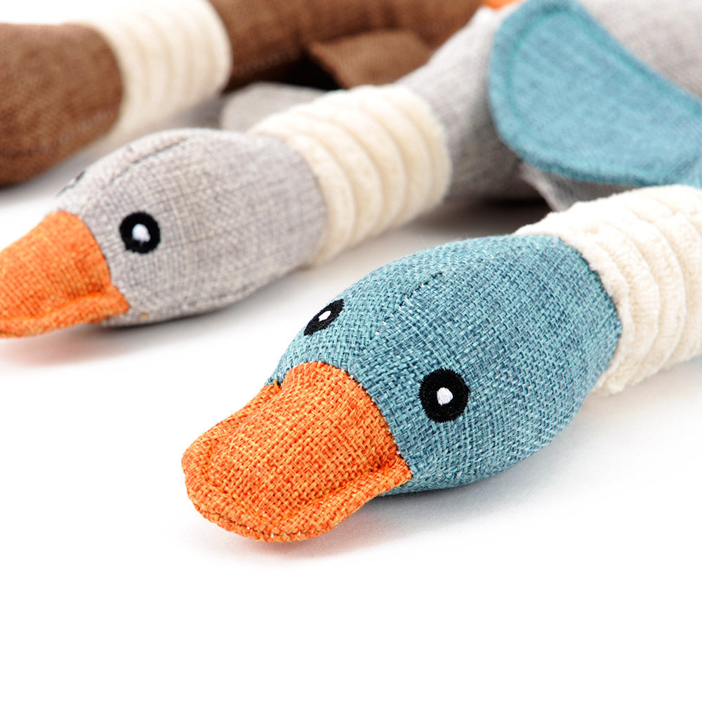Interactive plush squeaky dog toy featuring colorful duck designs for fun and engaging playtime for dogs.