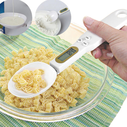 LCD digital kitchen scale with LCD display showing internal mechanism and removable battery cover.