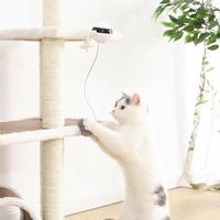 Interactive electronic cat toy in use, providing engagement and playtime for a curious cat.