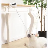 Interactive electronic cat toy in use, providing engagement and playtime for a curious cat.