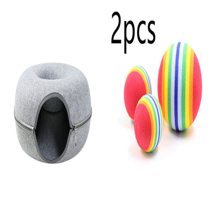 Two playful cats interacting with a 2-in-1 felt cat tunnel bed in stylish grey felt.