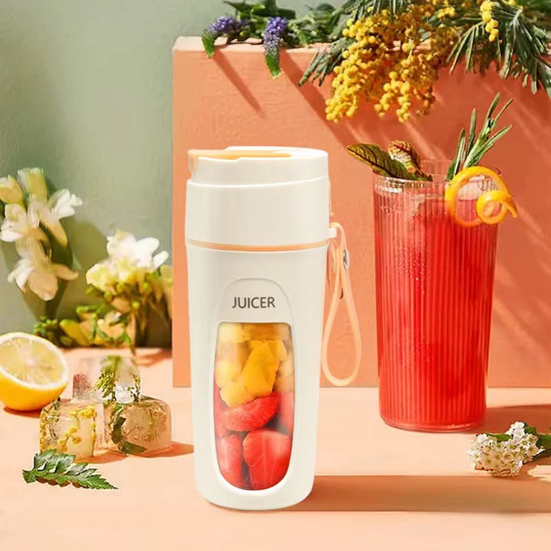 Portable USB blender cup filled with fruits, perfect for smoothies and juices, alongside a refreshing beverage.