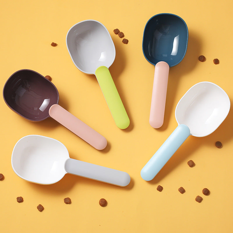 Colorful pet food scoops for measuring pet food, featuring a lightweight design and ergonomic handles.