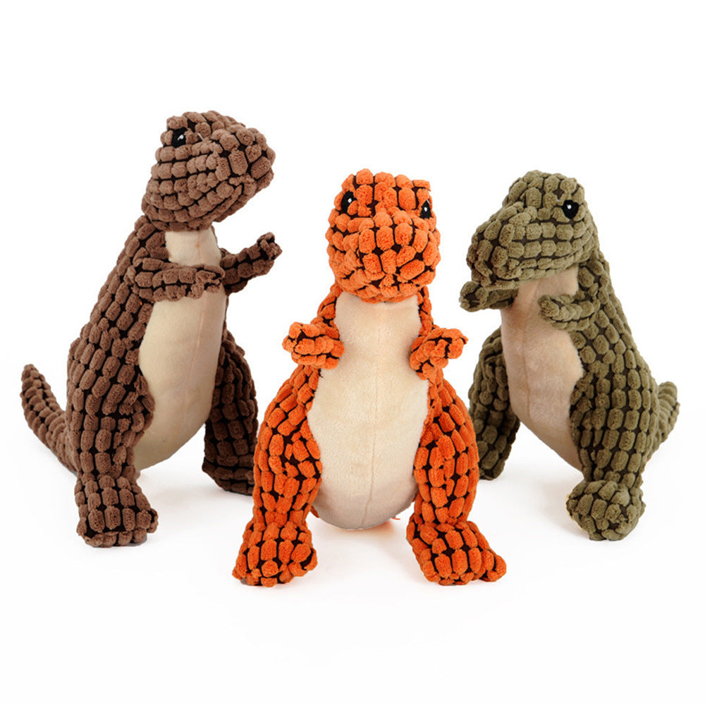 Close-up of a person squeezing a soft dinosaur squeaky dog toy in orange color.
