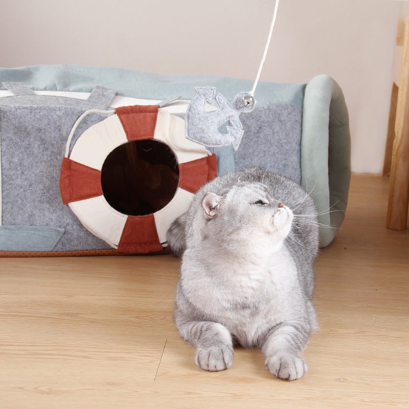 Folding channel semi-enclosed cat litter with a playful cat and a dangling toy, ideal for a foldable cat tunnel bed.