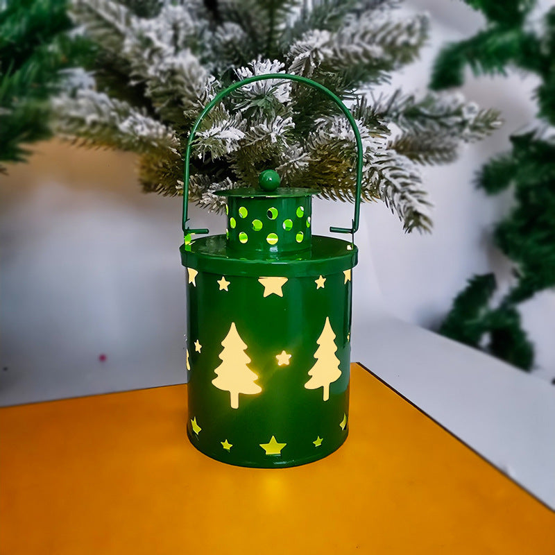 LED Christmas candle lantern featuring a green design with tree and star cutouts, perfect for holiday decor.