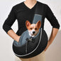 Person carrying a pet crossbody carrier bag with a dog inside, showcasing comfort and portability for pet transport.