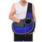 A person holding a pet crossbody carrier bag, featuring a breathable design and adjustable strap, ideal for dogs and cats.