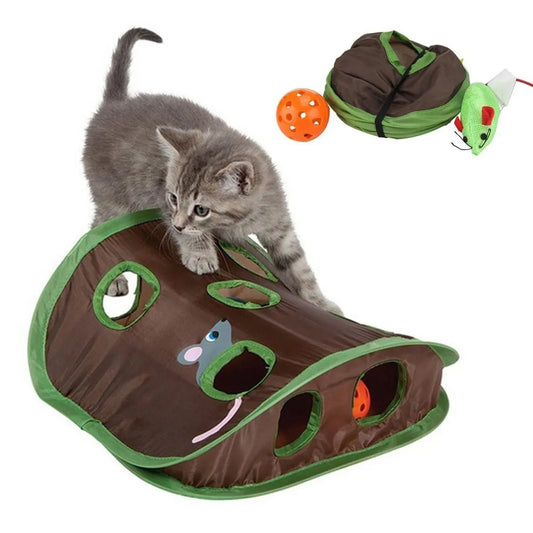 Interactive cat hide and seek toy with a playful kitten exploring nine holes and hidden balls.