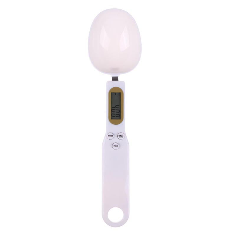 LCD digital kitchen scale with LCD display showing internal mechanism and removable battery cover.