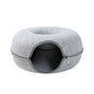 Two playful cats interacting with a 2-in-1 felt cat tunnel bed in stylish grey felt.