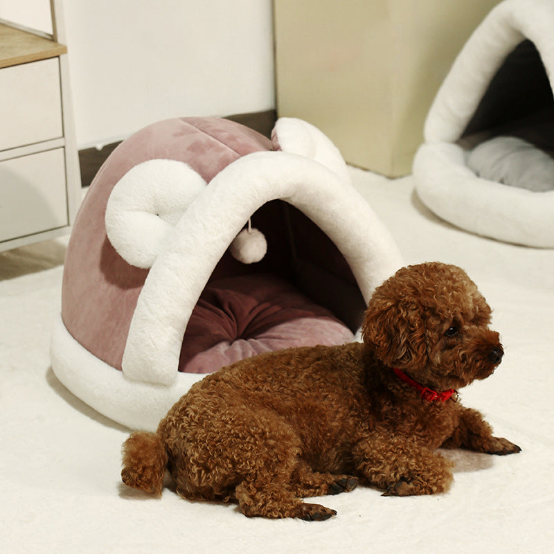 Self-warming cat cave bed with a cozy tent design for small dogs and cats, providing warmth and comfort.