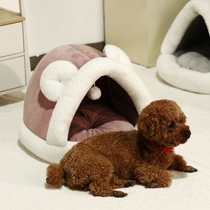 Self-warming cat cave bed with a cozy tent design for small dogs and cats, providing warmth and comfort.