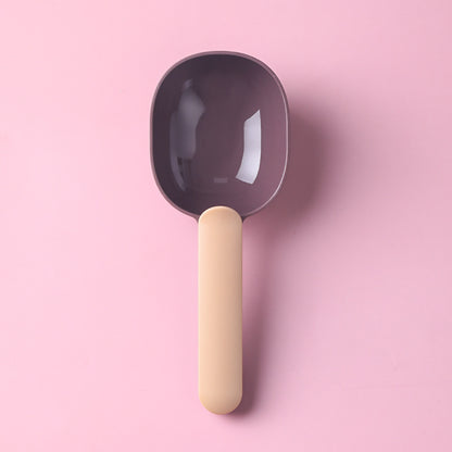  Pet food scoop designed for measuring and serving pet food, featuring a blue handle and a white scoop.