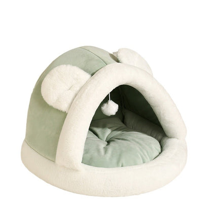 Cozy self-warming cat cave bed with soft plush interior and ear-like design for cats and small dogs.