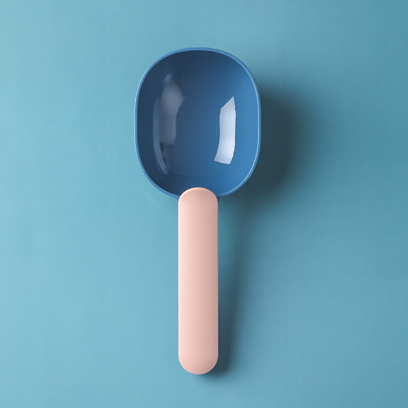  Pet food scoop designed for measuring and serving pet food, featuring a blue handle and a white scoop.