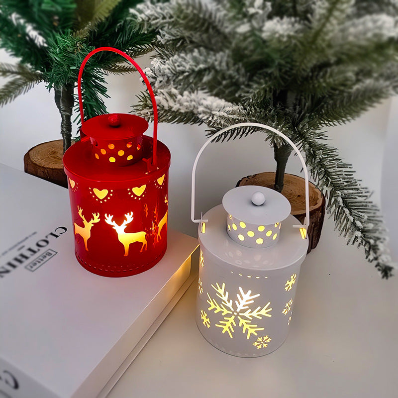 LED Christmas candle lanterns with festive designs, illuminating a cozy holiday decor setting.