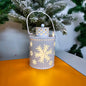 LED Christmas candle lantern with snowflake design, perfect holiday decoration for mantels and tables.